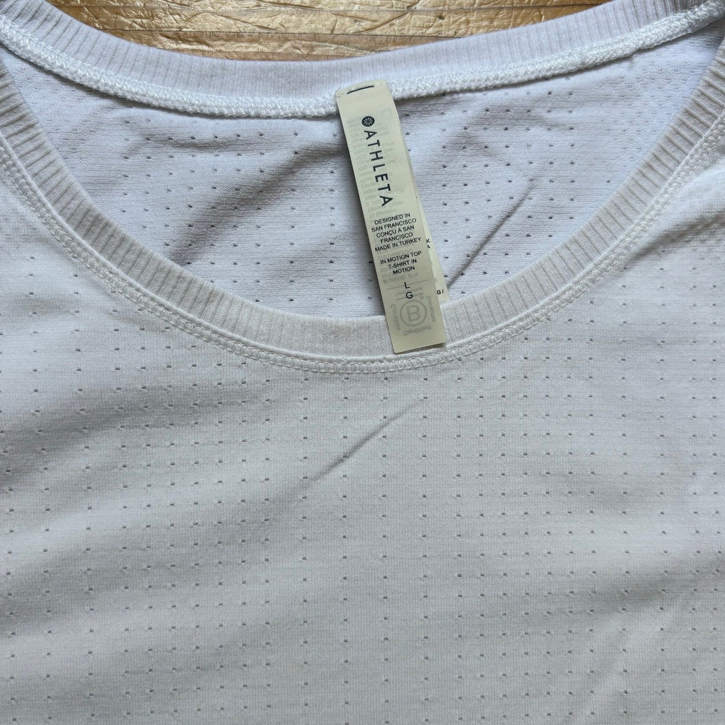 Athleta In Motion white perforate long sleeve seamless athletic shirt SIZE L