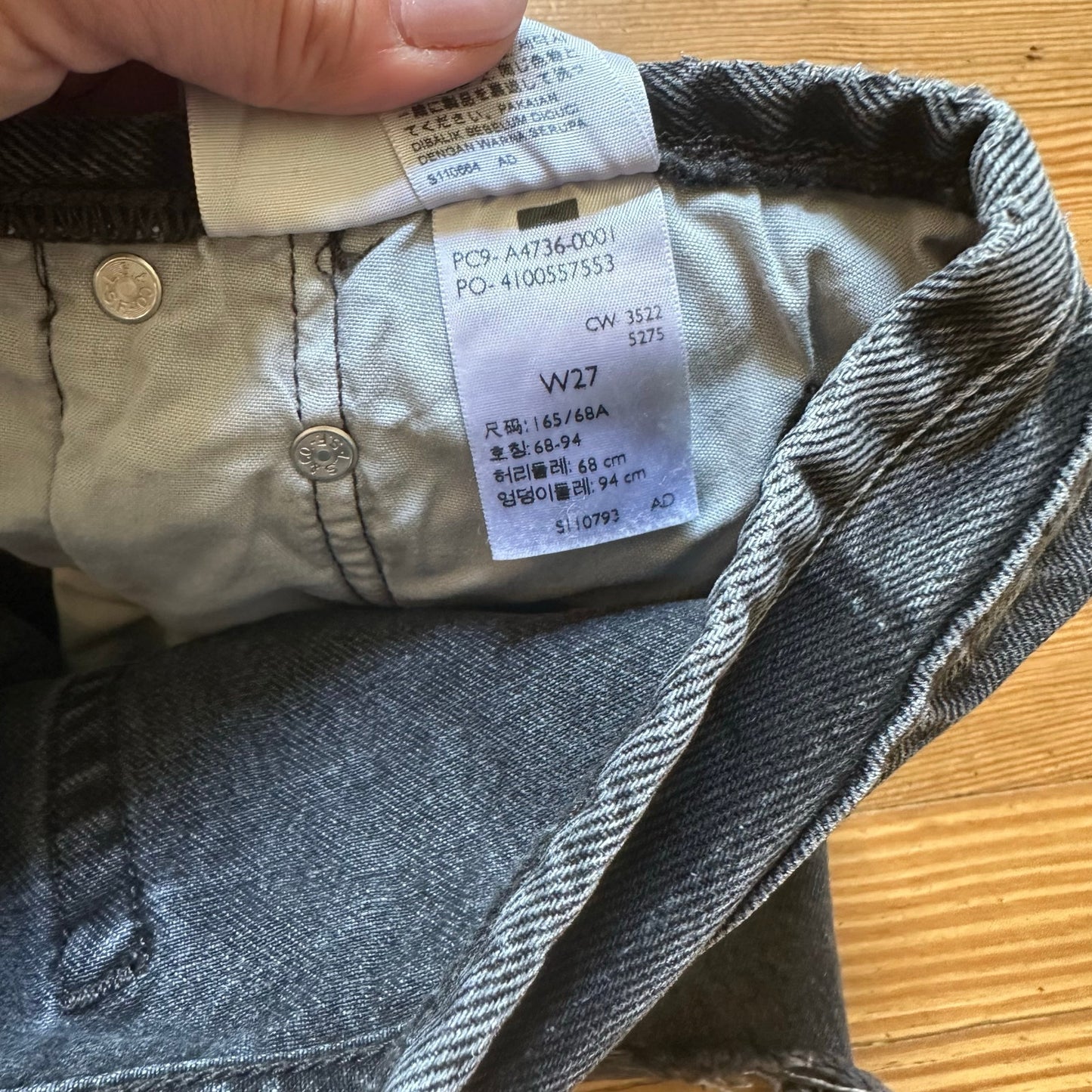 Levi's 501 distressed raw hem button fly black jean shorts SIZE 27