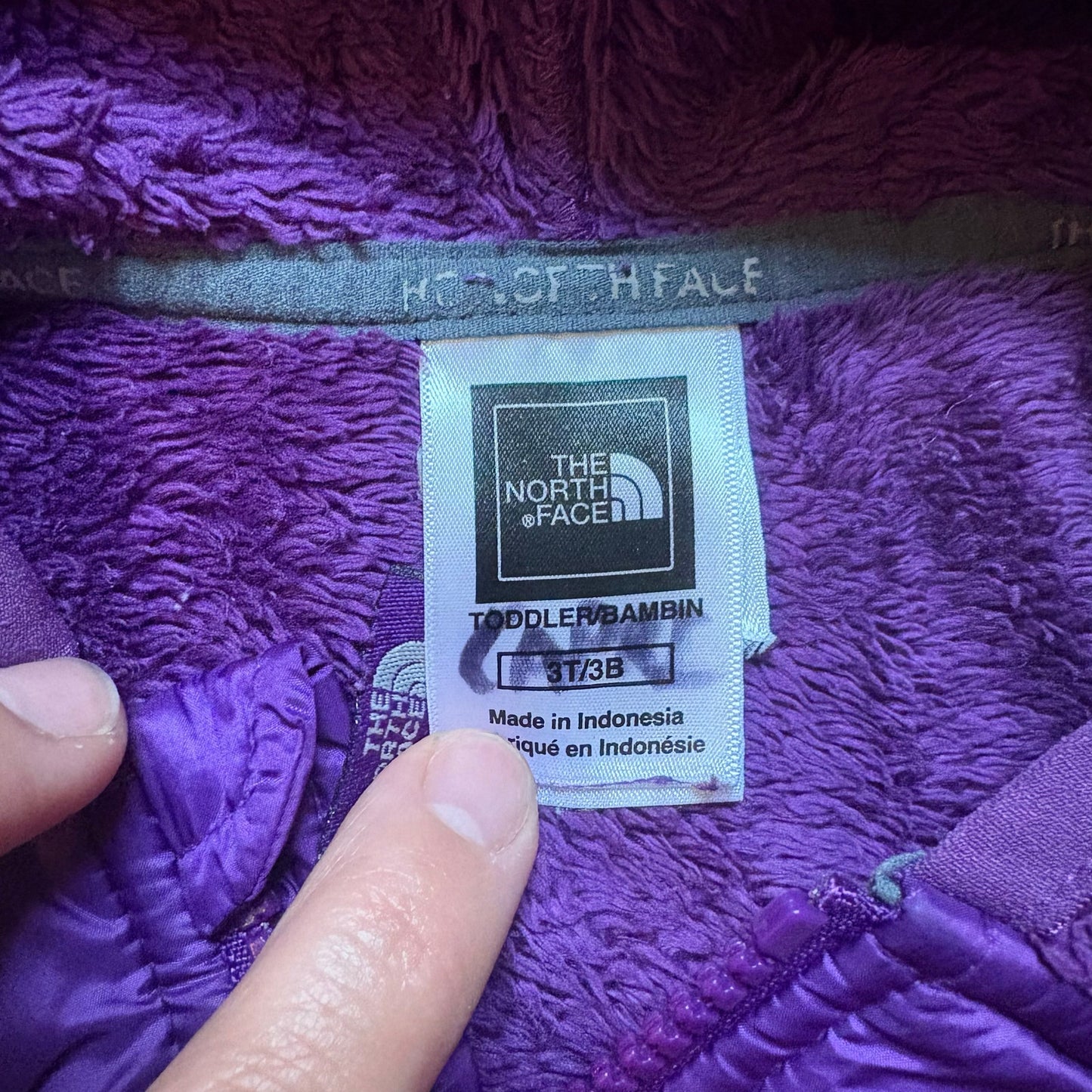 The North Face dark purple fleece full zip hooded toddler
sweater SIZE 3T
