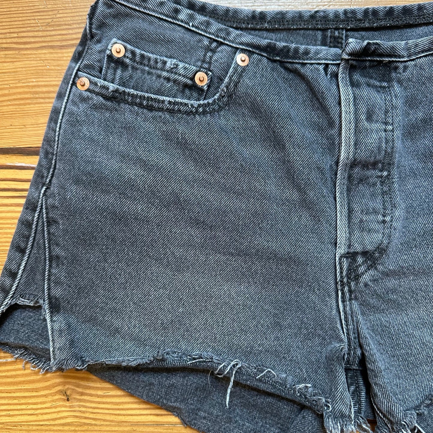 Levi's 501 distressed raw hem button fly black jean shorts SIZE 27